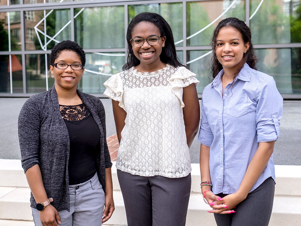 2022 FERN Fellows standing on steps outside GFRP office; from left: Tiffany Williams, Emerald Izuakor, and Sydni Wright