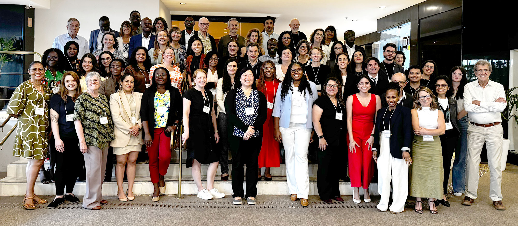 Group photo of Evaluation Advisory Committee members and global research partners